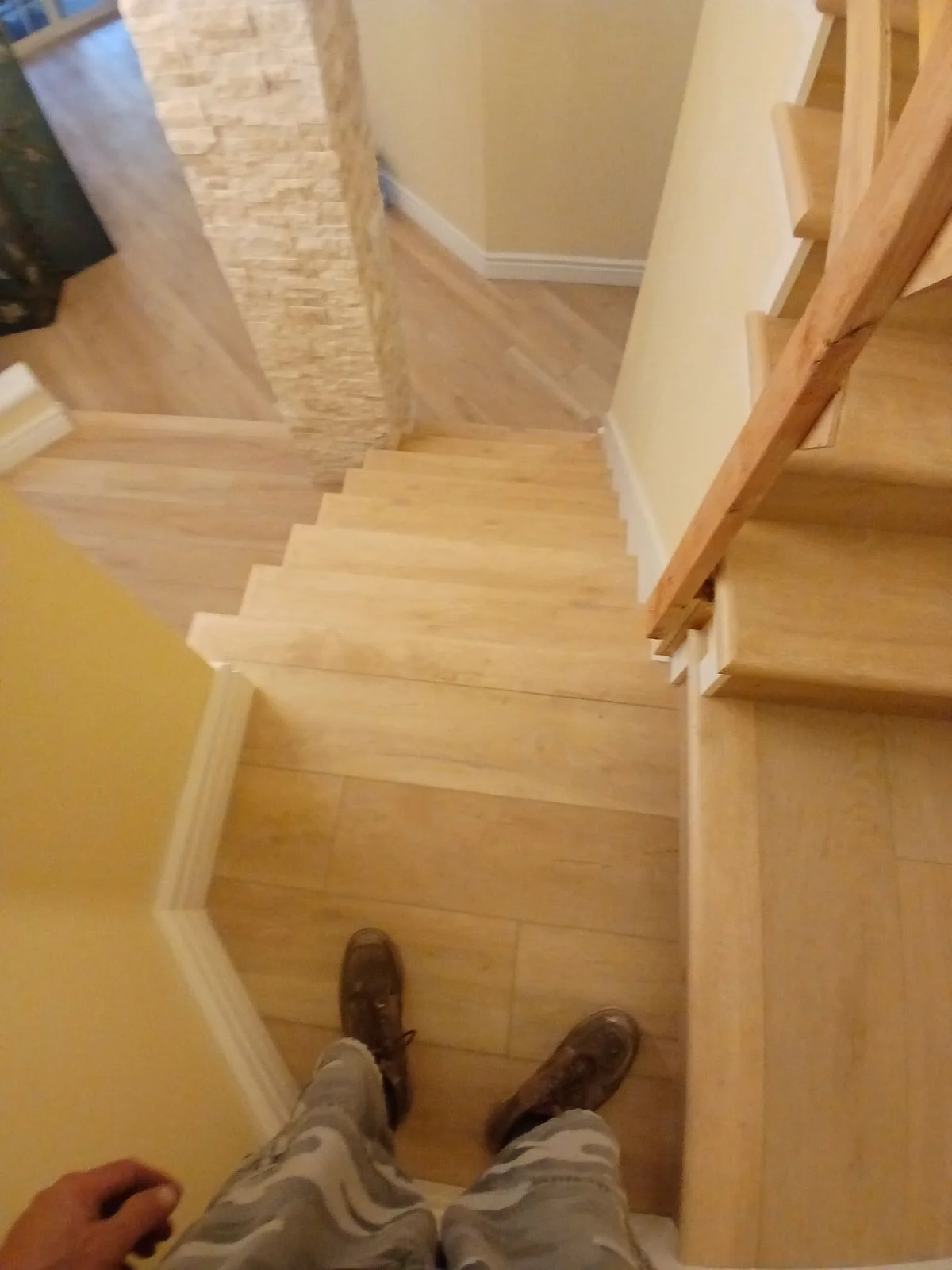Natural oak hardwood staircase with oak handrails and white painted walls